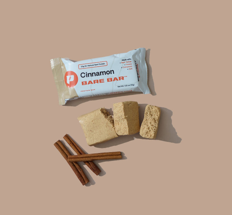 Cinnamon Bare Bar with packaging on a beige background